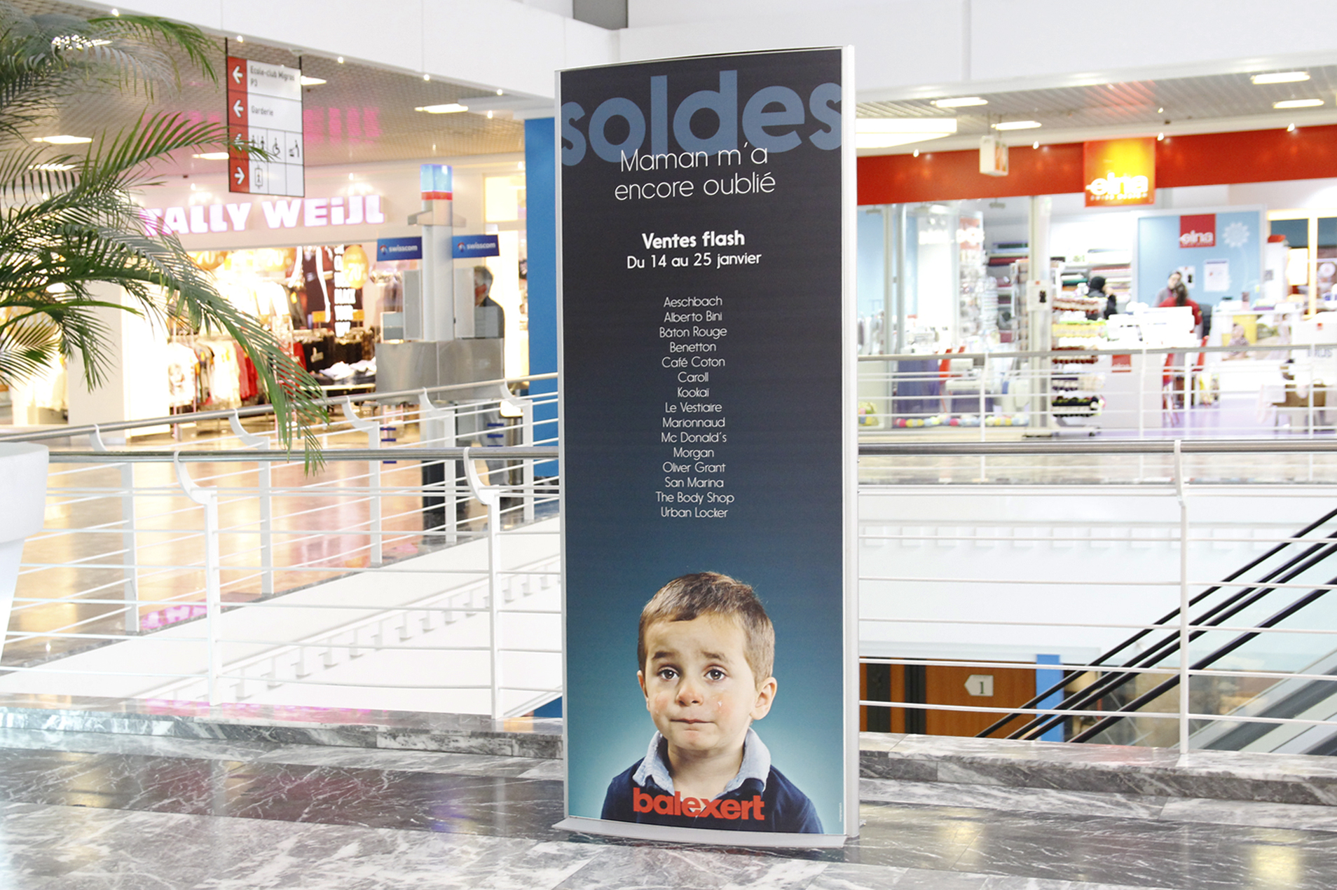 Display of a totem continuing the theme of the print advertising campaign in the shopping mall